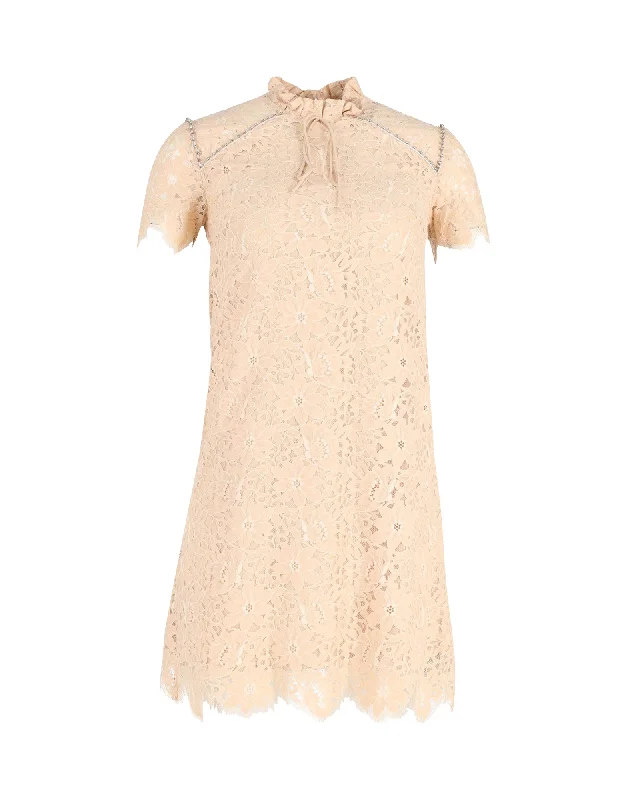 Layering dresses for versatile stylingSandro Embellished Lace Mini Dress in Beige Cotton