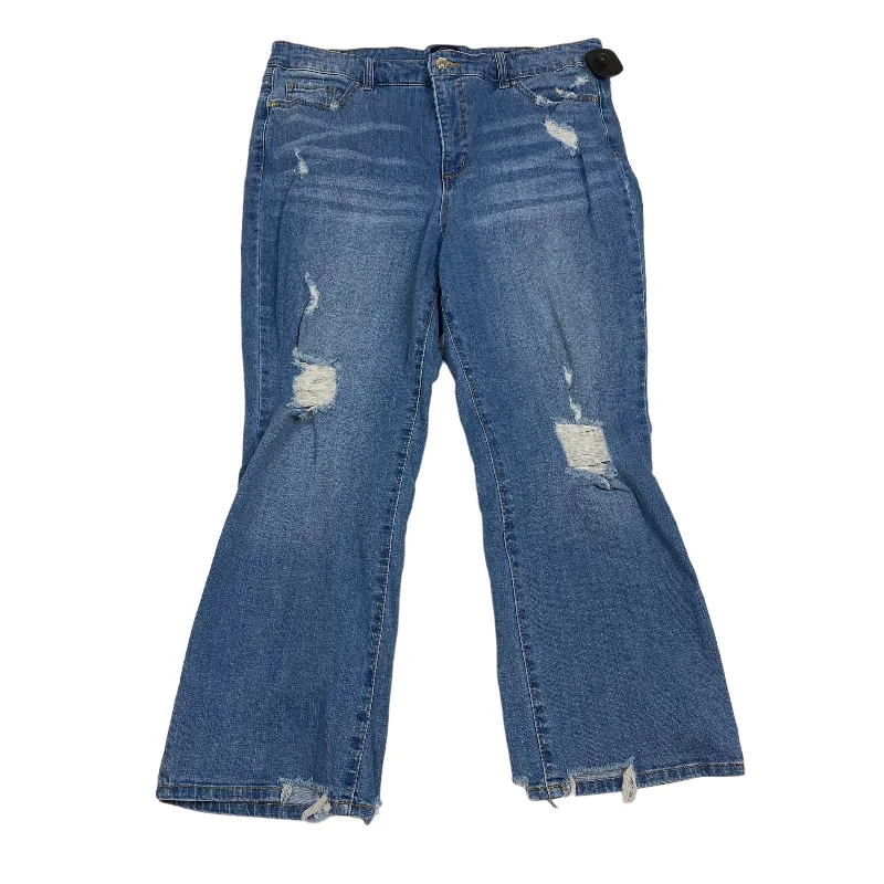 Ripped and repaired jeans for a rugged lookBlue Denim Jeans Cropped Scoop, Size 14